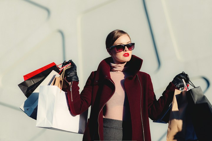 A woman carrying shopping bags in a city