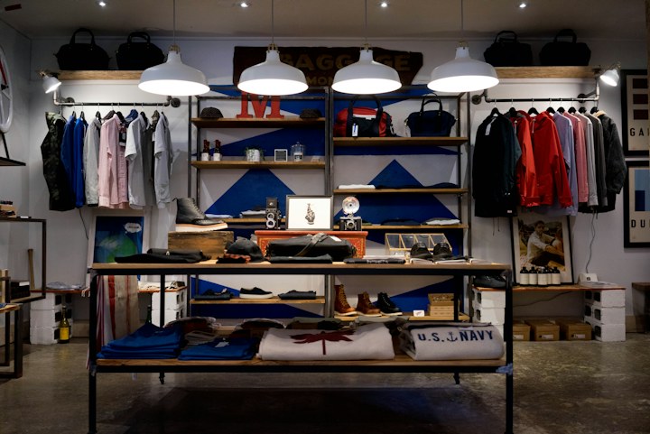 Clothing and accessories in a bright, airy boutique